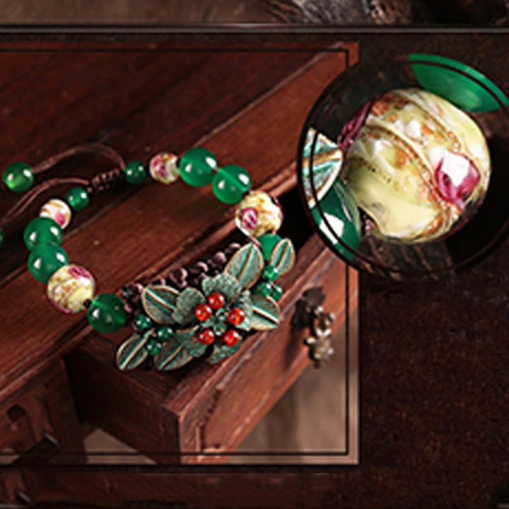 Bracciale con supporto a nodo intrecciato in perline di vetro agata verde Buddha Stones