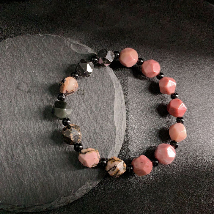 Braccialetto curativo con perline poligonali in pietra di rodonite naturale con linea nera e macchie rosse Buddha Stones