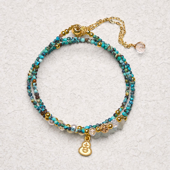 Braccialetto Buddha Stones con perline turchesi e triplo giro