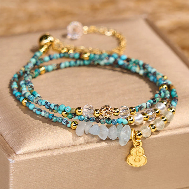 Braccialetto Buddha Stones con perline turchesi e triplo giro