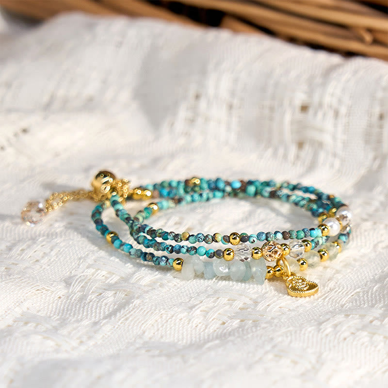 Braccialetto Buddha Stones con perline turchesi e triplo giro