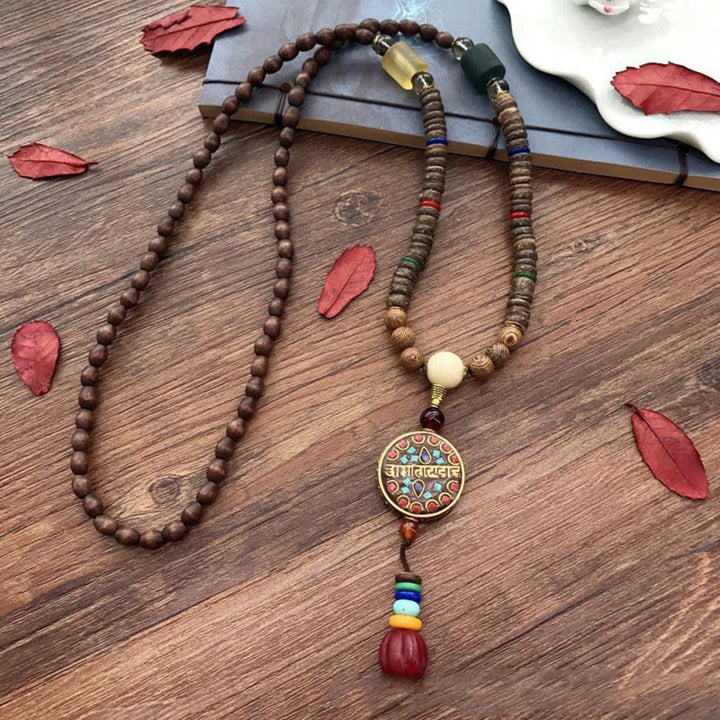 Collana con ciondolo in perline di rame, mantra luminoso, perline di rame, ciondolo in legno di Schima, fatto a mano in tibetano con Buddha Stones .