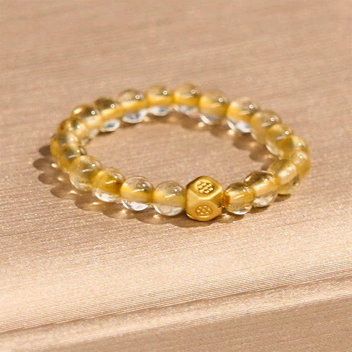 Anello elastico con perle di quarzo rutilato dorato da 3 mm Buddha Stones