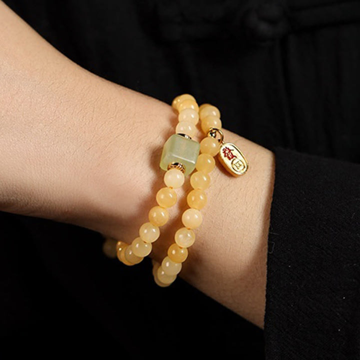 Bracciale della ricchezza con doppio cerchio, Buddha Stones di topazio e cubo di giada