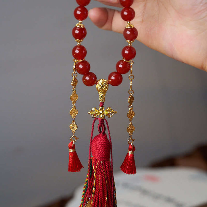 Buddha Stones 18 perle monete di rame nappa tibetana agata rossa mala da polso calmo