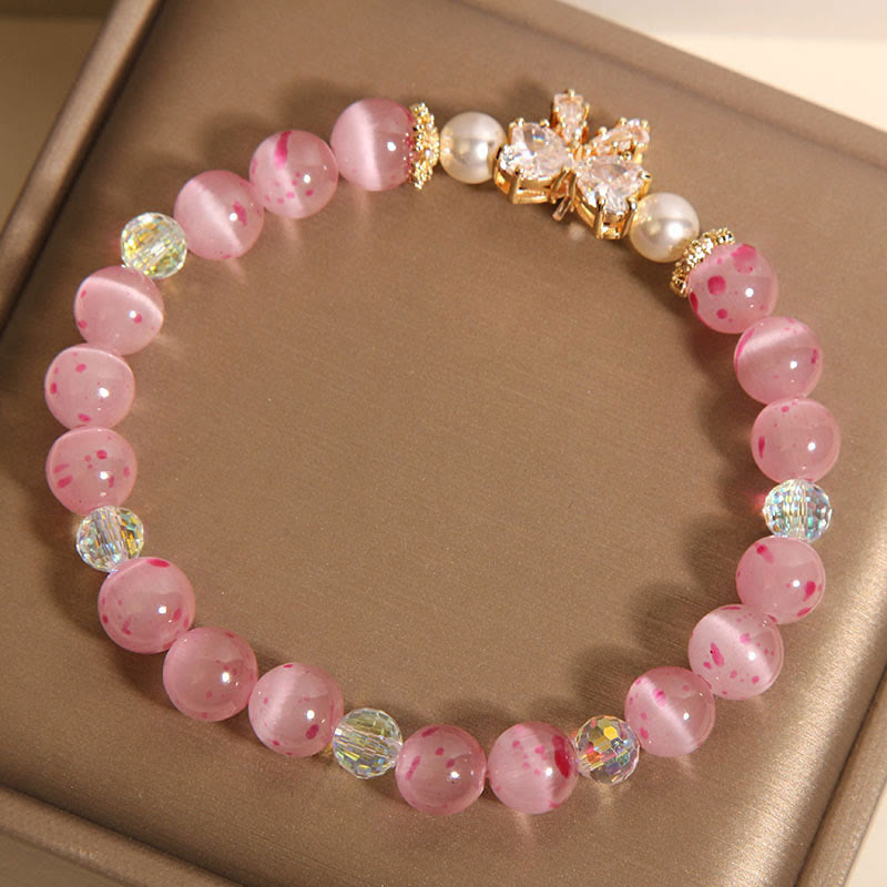 Braccialetto di supporto con fiocco e rosetta, in perle occhio di gatto rosa e fiori di ciliegio Buddha Stones
