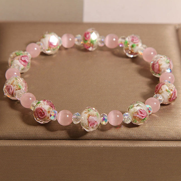 Braccialetto di calore con perline di vetro Liuli, cristallo rosa e Buddha Stones
