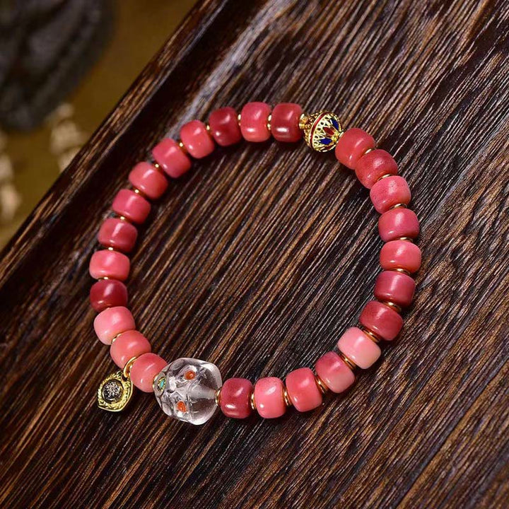 Braccialetto della fortuna in agata rossa e rame con osso di cammello tibetano Buddha Stones