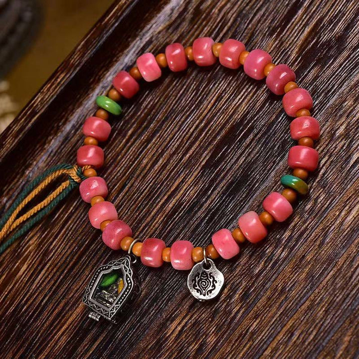 Braccialetto della fortuna in agata rossa e rame con osso di cammello tibetano Buddha Stones