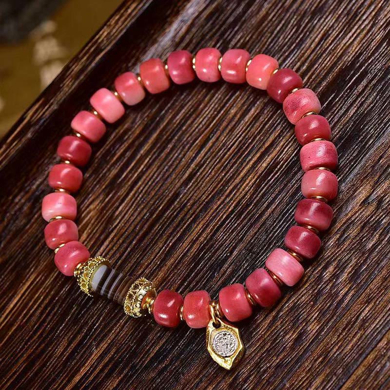 Braccialetto della fortuna in agata rossa e rame con osso di cammello tibetano Buddha Stones