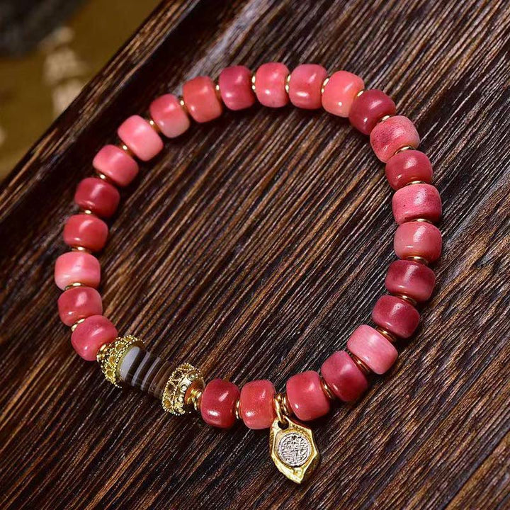 Braccialetto della fortuna in agata rossa e rame con osso di cammello tibetano Buddha Stones