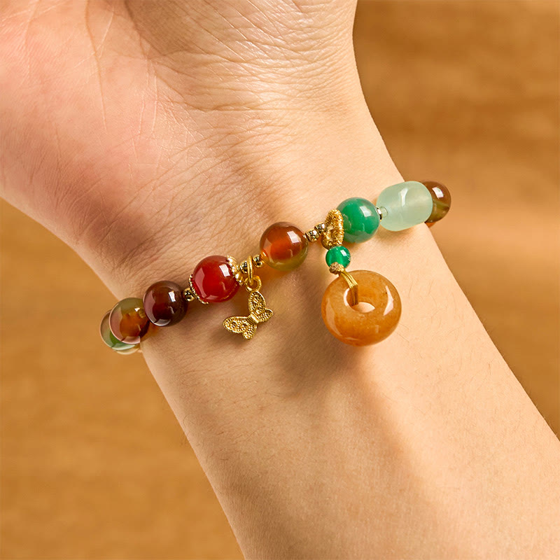 Braccialetto di supporto con fibbia della pace a farfalla, mughetto, agata pavone colorata naturale di Buddha Stones