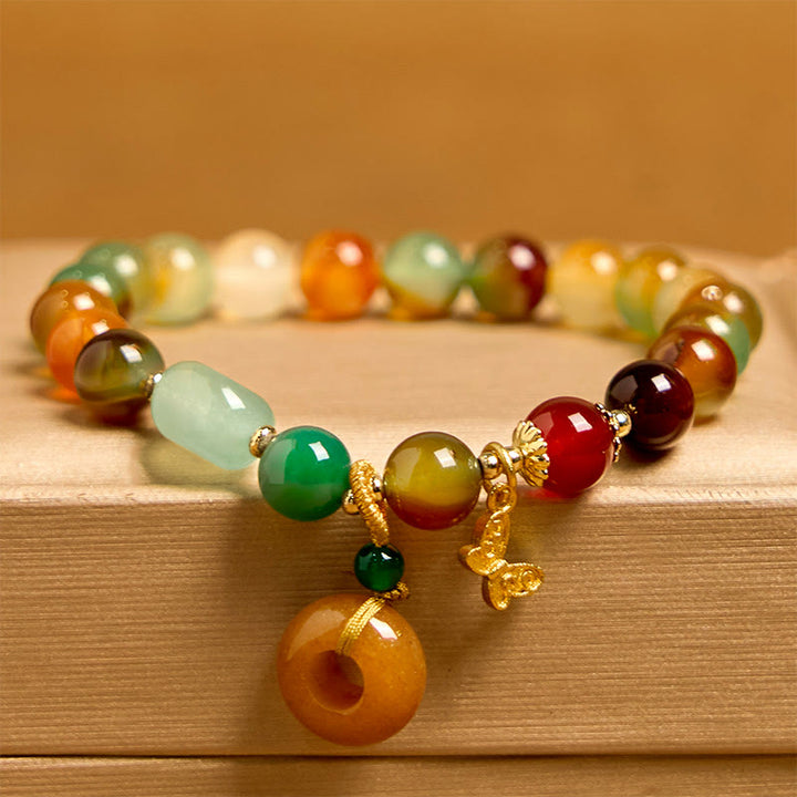 Braccialetto di supporto con fibbia della pace a farfalla, mughetto, agata pavone colorata naturale di Buddha Stones