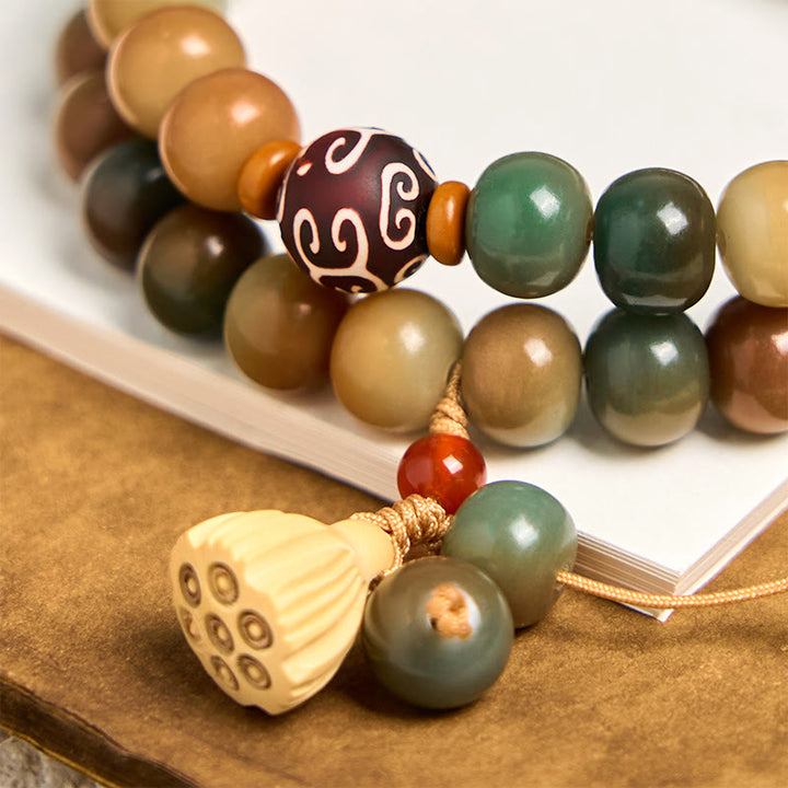 Bracciale doppio giro con ciondolo a forma di baccello di loto con semi di Bodhi colorati Buddha Stones