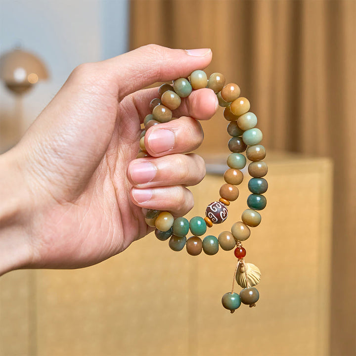 Bracciale doppio giro con ciondolo a forma di baccello di loto con semi di Bodhi colorati Buddha Stones
