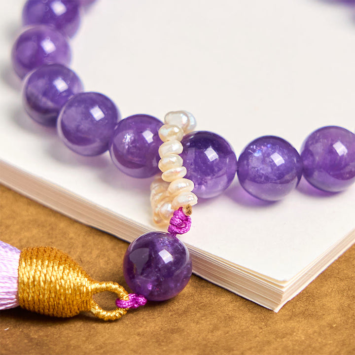 Bracciale da meditazione con nappe e perle di ametista naturale Buddha Stones