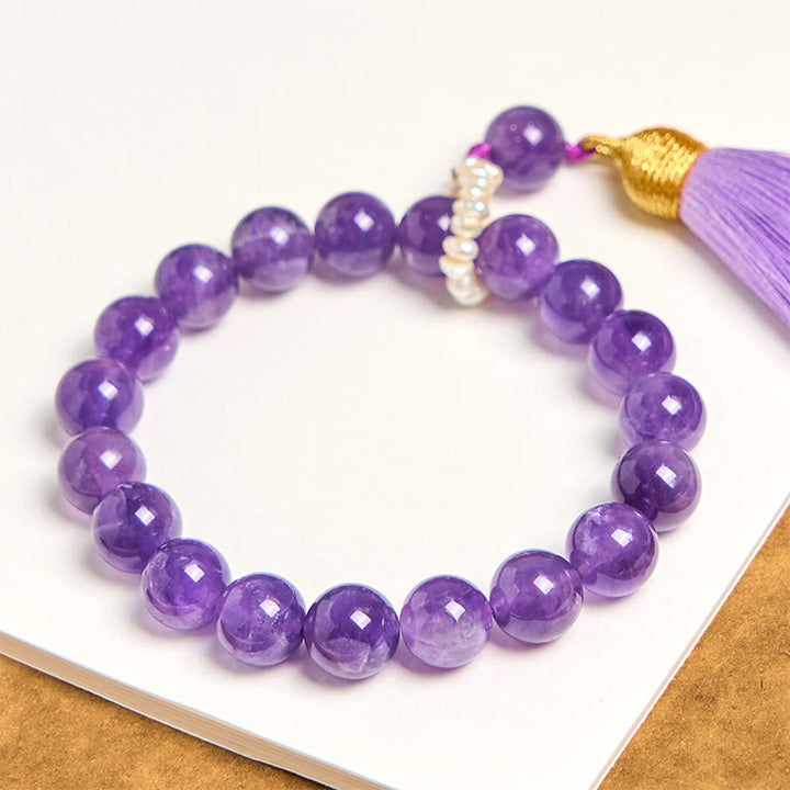 Bracciale da meditazione con nappe e perle di ametista naturale Buddha Stones