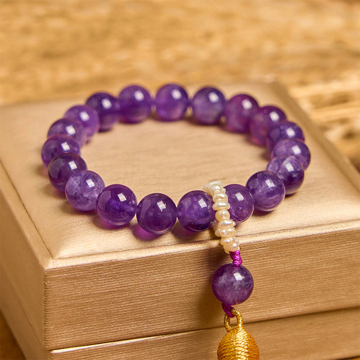 Bracciale da meditazione con nappe e perle di ametista naturale Buddha Stones