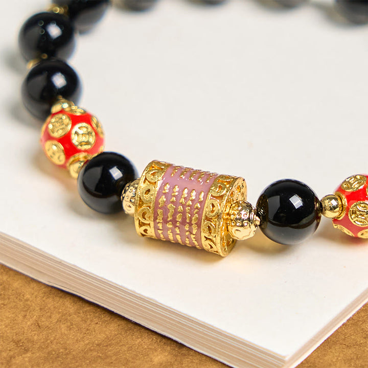 Bracciale della fortuna con cinque monete di rame e onice nero naturale di Buddha Stones