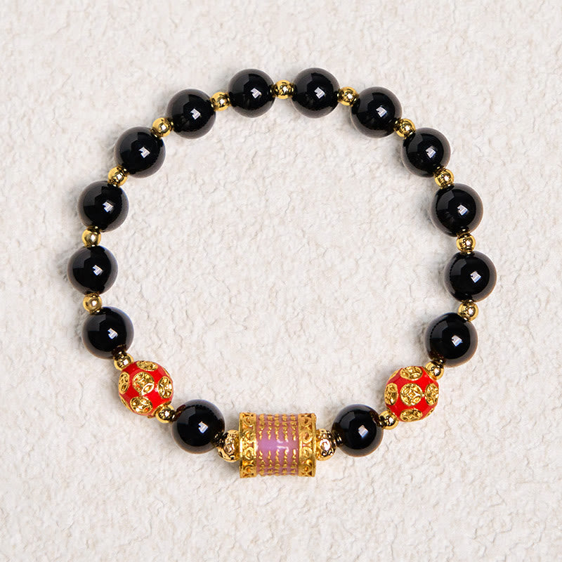 Bracciale della fortuna con cinque monete di rame e onice nero naturale di Buddha Stones