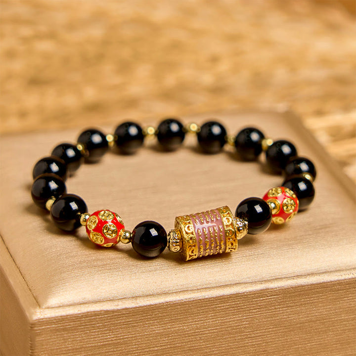 Bracciale della fortuna con cinque monete di rame e onice nero naturale di Buddha Stones