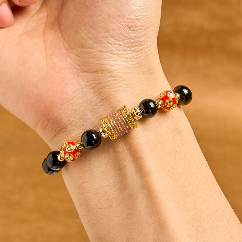Bracciale della fortuna con cinque monete di rame e onice nero naturale di Buddha Stones