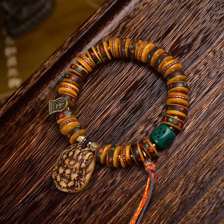 Braccialetto di protezione con nappa in osso di cammello tibetano Buddha Stones