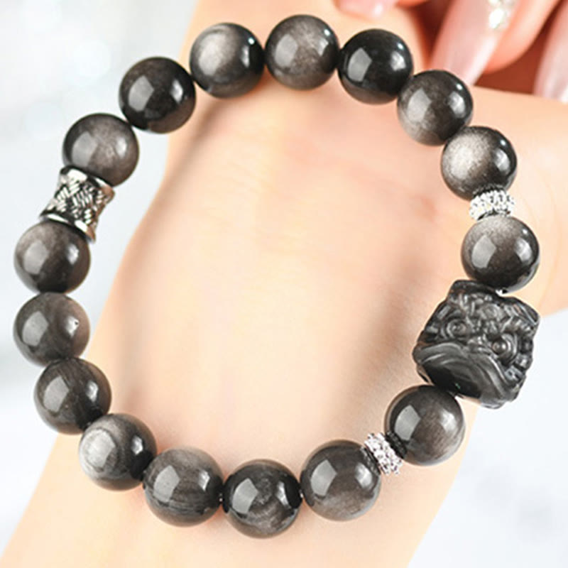 Bracciale di protezione della danza del leone in ossidiana lucida e argento naturale Buddha Stones