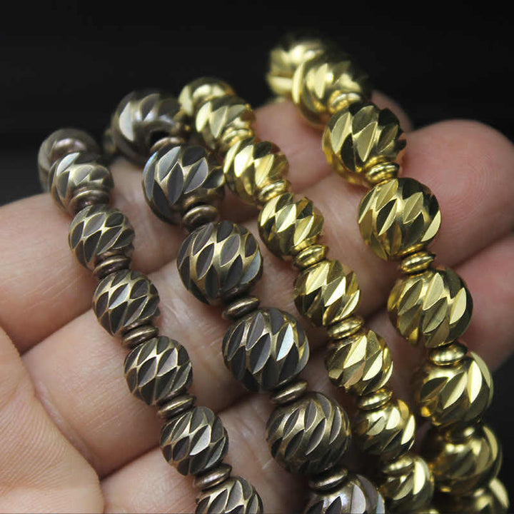 Braccialetto della ricchezza con perline di ottone e rame, motivo a coltello anticato , Buddha Stones