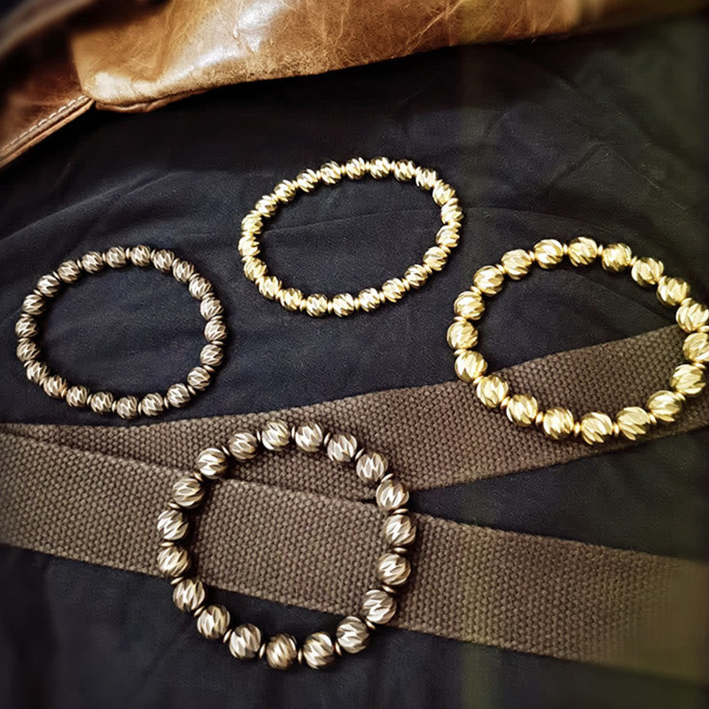 Braccialetto della ricchezza con perline di ottone e rame, motivo a coltello anticato , Buddha Stones
