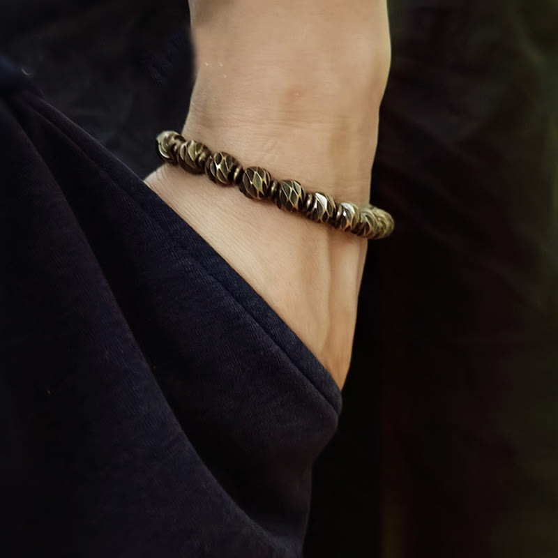 Braccialetto della ricchezza con perline di ottone e rame, motivo a coltello anticato , Buddha Stones