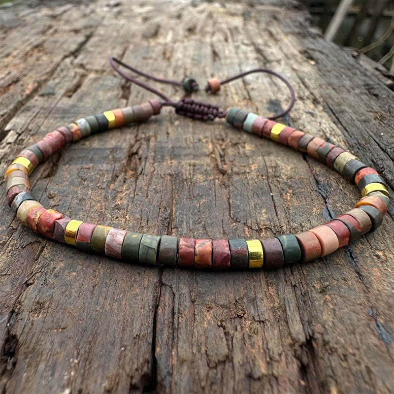Bracciale con perline distanziatrici in rodonite e Buddha Stones per la guarigione delle relazioni
