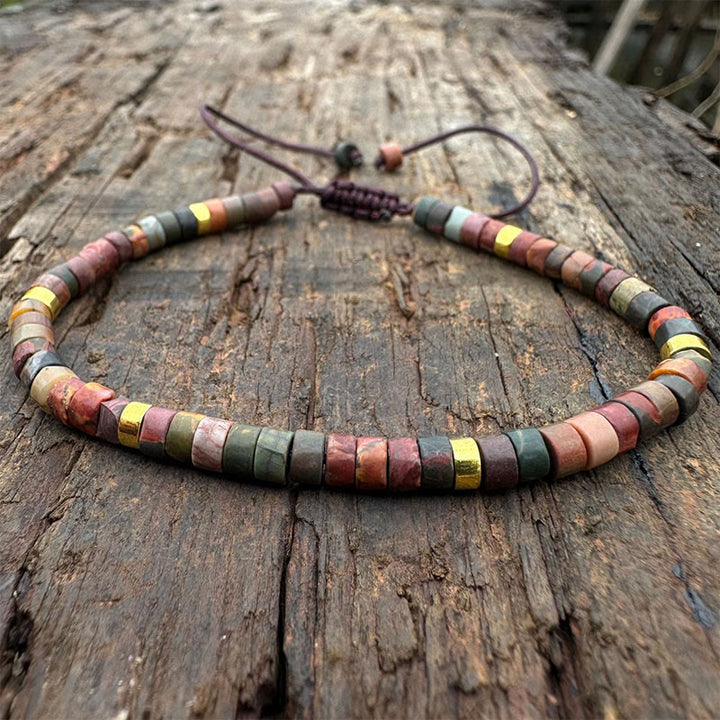 Bracciale con perline distanziatrici in rodonite e Buddha Stones per la guarigione delle relazioni
