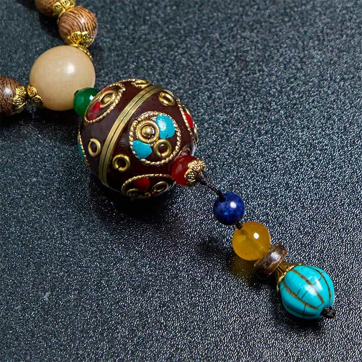 Collana con ciondolo in perline di rame, mantra luminoso, perline di rame, ciondolo in legno di Schima, fatto a mano in tibetano con Buddha Stones .