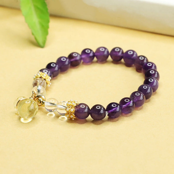 Bracciale Buddha Stones con ciondolo a forma di borsa porta soldi in ametista e citrino naturale