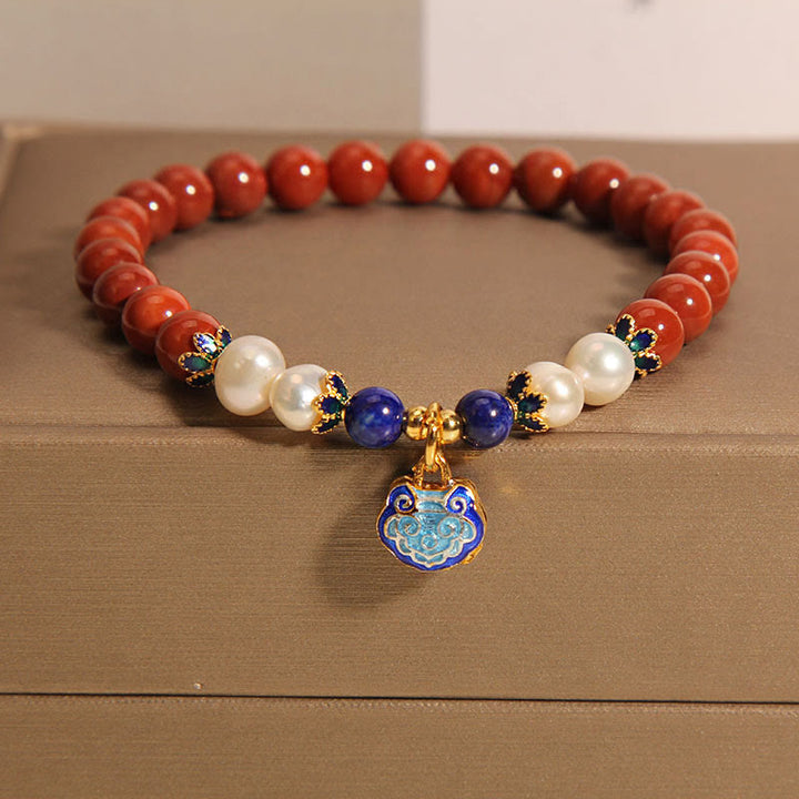 Bracciale positivo con ciondolo a forma di lucchetto della pace in agata rossa naturale del sud di Buddha Stones