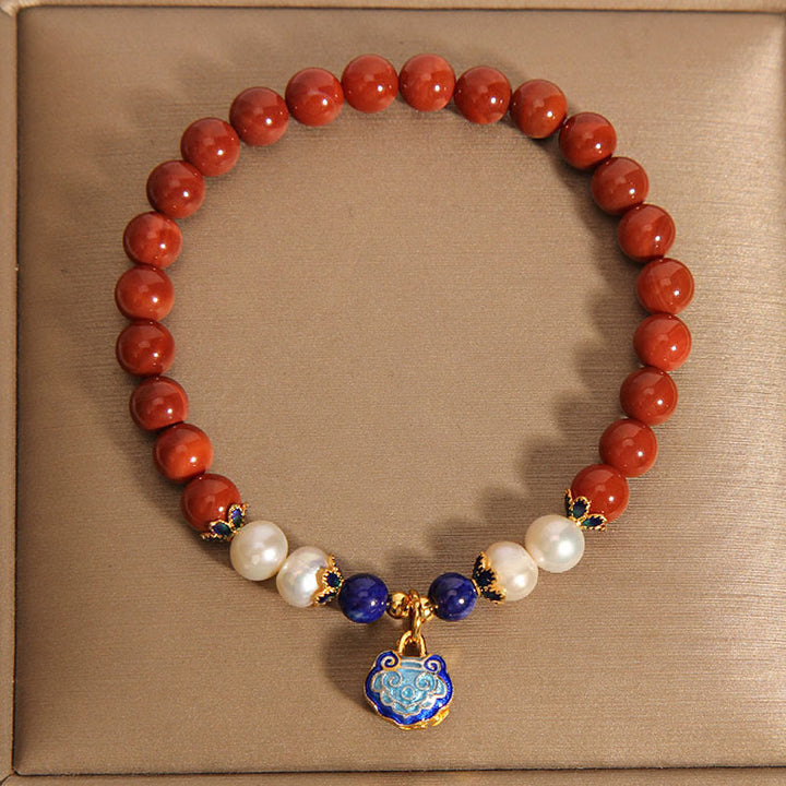 Bracciale positivo con ciondolo a forma di lucchetto della pace in agata rossa naturale del sud di Buddha Stones