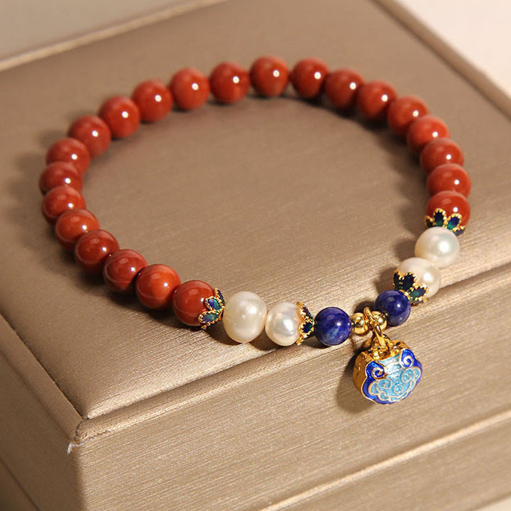 Bracciale positivo con ciondolo a forma di lucchetto della pace in agata rossa naturale del sud di Buddha Stones
