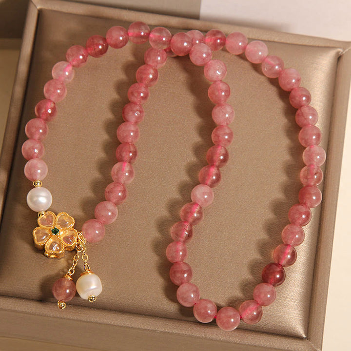 Braccialetto Buddha Stones con design positivo a doppio giro, in quarzo fragola e quadrifoglio