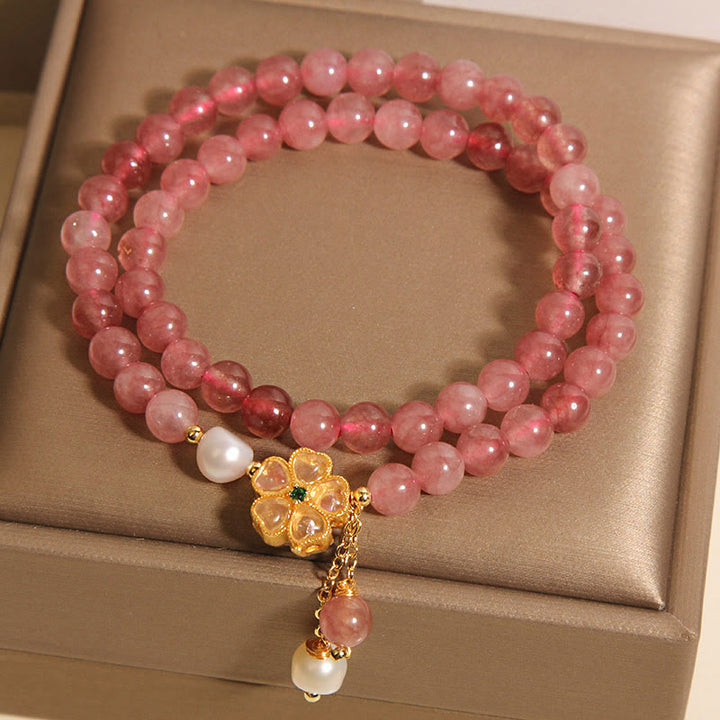 Braccialetto Buddha Stones con design positivo a doppio giro, in quarzo fragola e quadrifoglio