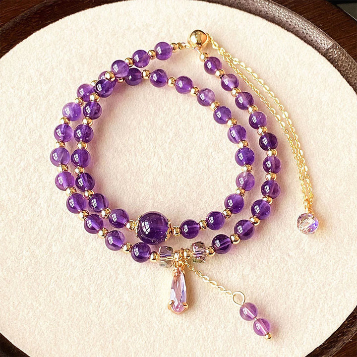Bracciale multistrato in perle di ametista naturale Buddha Stones