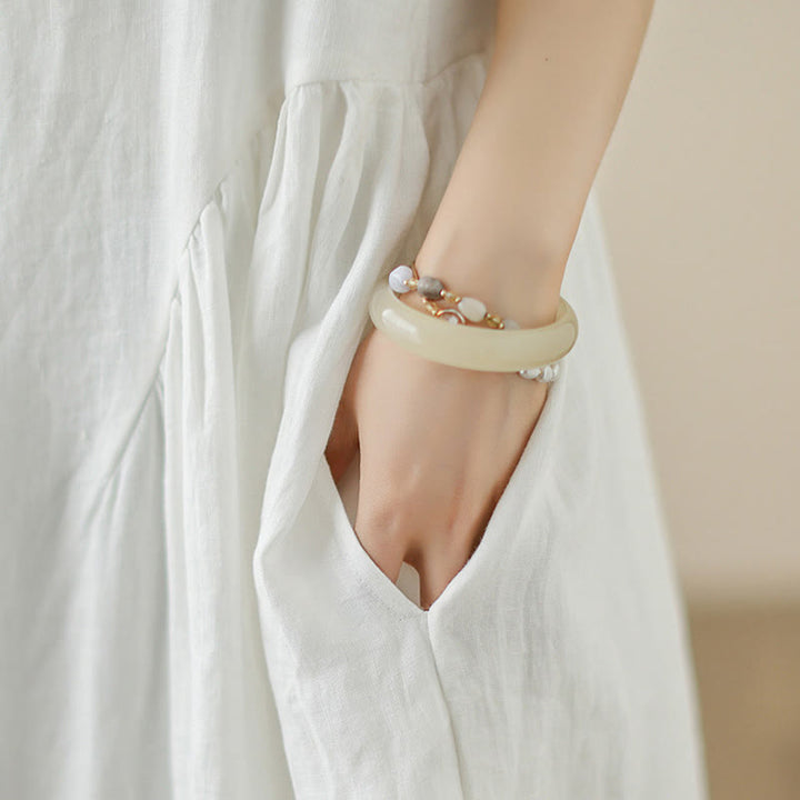 Abito midi in cotone senza maniche con tasche, motivo floreale bianco casual con bottoni sul retro Buddha Stones - image 8