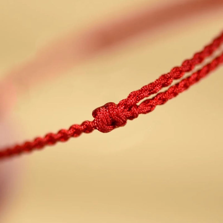 Braccialetto di benedizione con perle di cinabro e Buddha Stones in legno di pesca