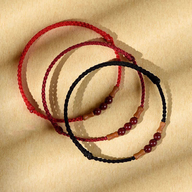 Braccialetto di benedizione con perle di cinabro e Buddha Stones in legno di pesca