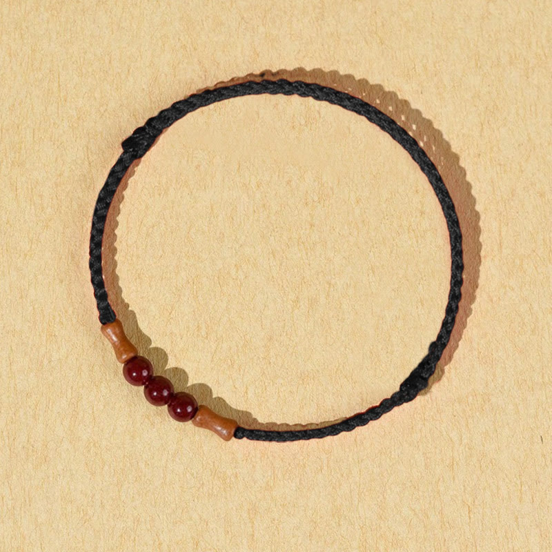 Braccialetto di benedizione con perle di cinabro e Buddha Stones in legno di pesca