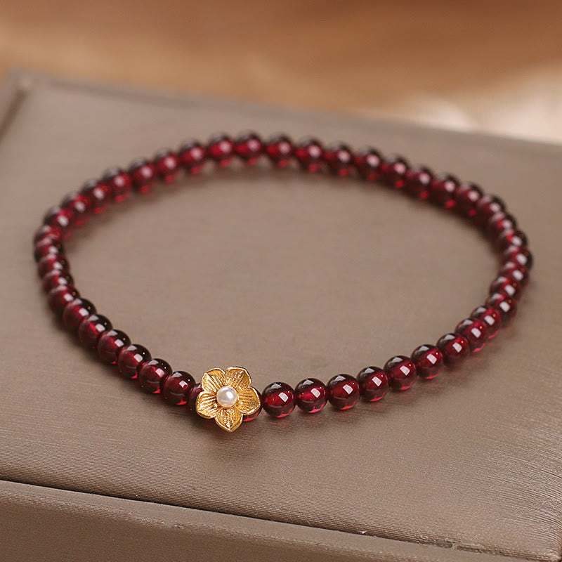 Bracciale Buddha Stones con perle di granato naturale da 4 mm e fiore della passione