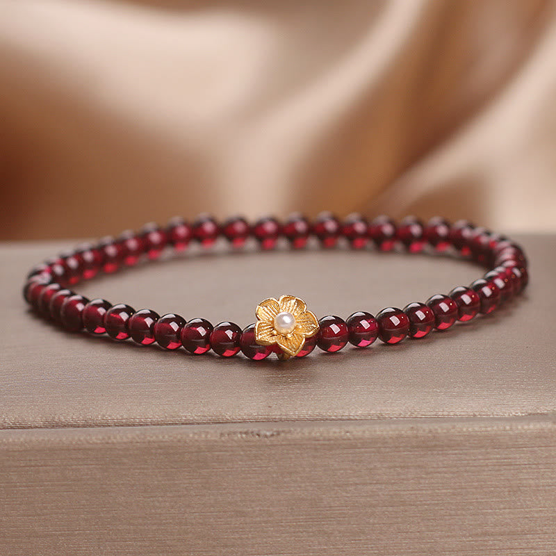 Bracciale Buddha Stones con perle di granato naturale da 4 mm e fiore della passione