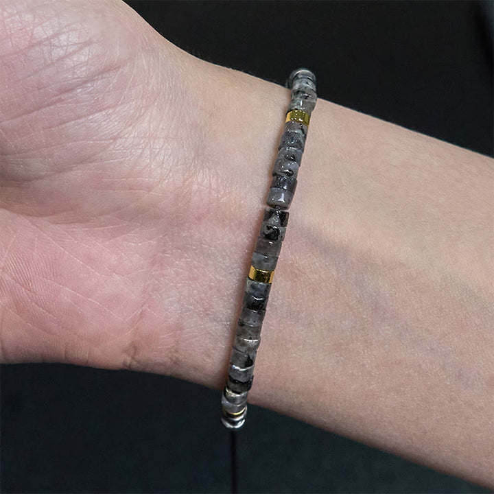 Bracciale con perline distanziatrici in pietra nera naturale con glitter Buddha Stones
