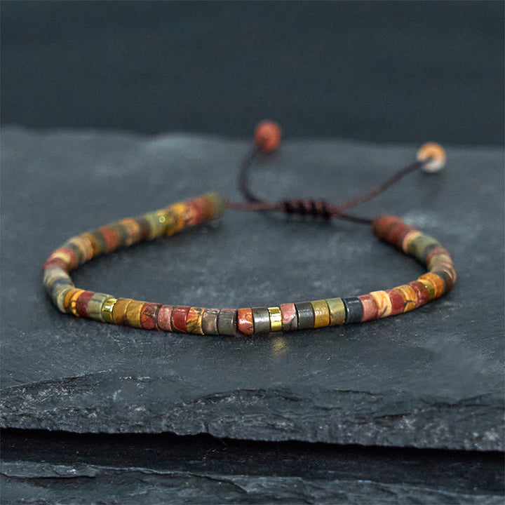 Bracciale con perline distanziatrici in rodonite e Buddha Stones per la guarigione delle relazioni