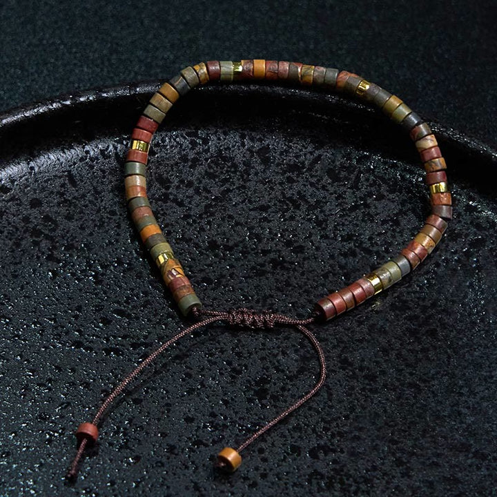 Bracciale con perline distanziatrici in rodonite e Buddha Stones per la guarigione delle relazioni